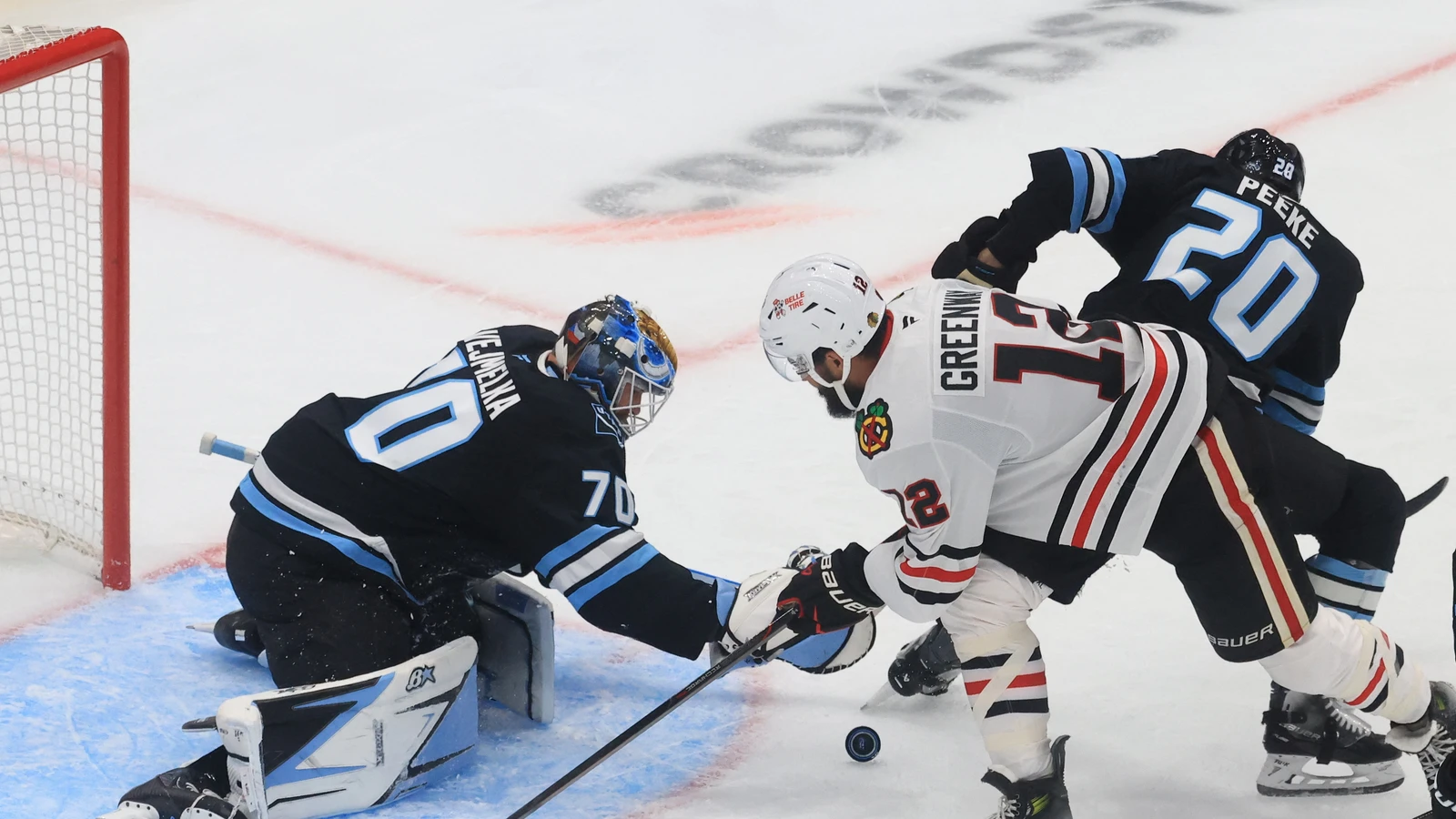File photo: Jordan Greenway plays the puck in front of the Utah Mammoth net at Delta Center.