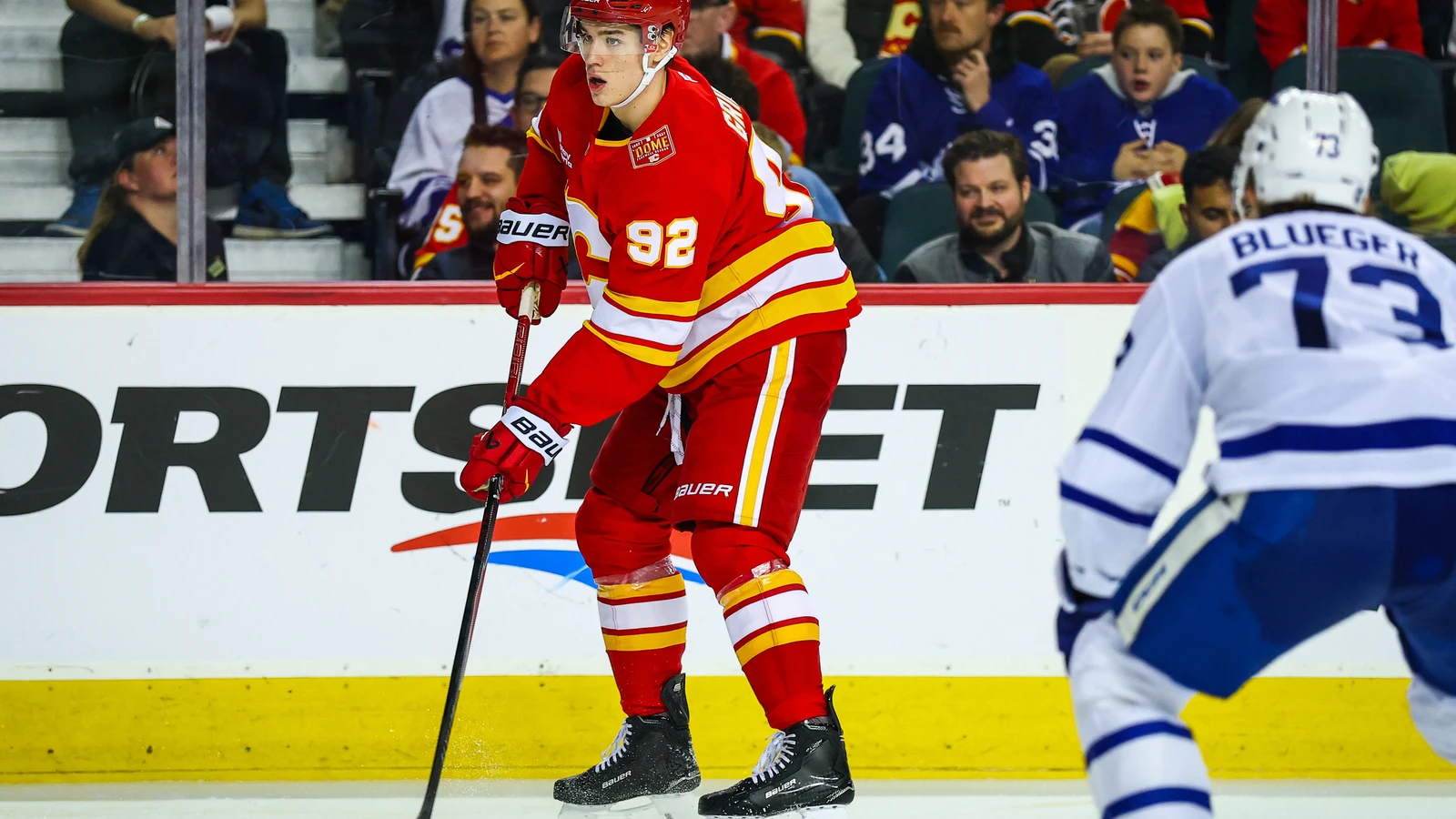 Calgary Flames forward Matvei Gridin controls the puck against the Toronto Maple Leafs at Scotiabank Saddledome.