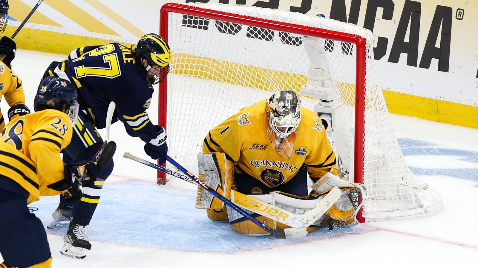 File photo: Nolan Moyle, wearing Michigan’s No. 27 jersey, shoots near the Quinnipiac net during an April 6, 2023 Frozen Four semifinal in Tampa, Florida.