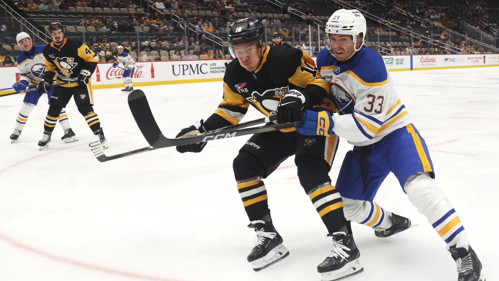 File photo: Andrei Kuzmenko battles for position with Buffalo defenceman Ryan Johnson during a preseason game at PPG Paints Arena.