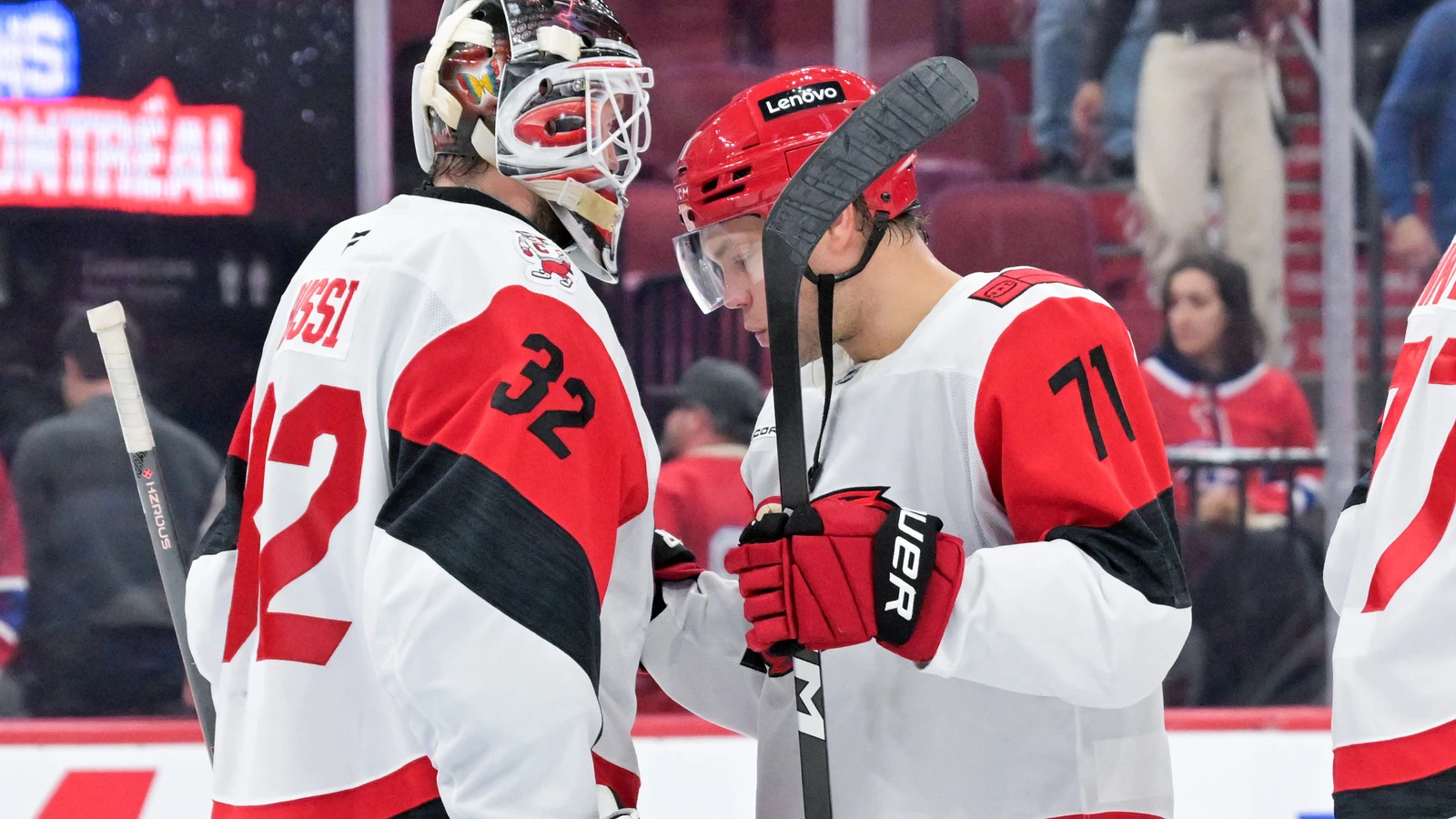 Carolina Hurricanes forward Taylor Hall celebrates with goaltender Brandon Bussi after their win at Bell Centre.