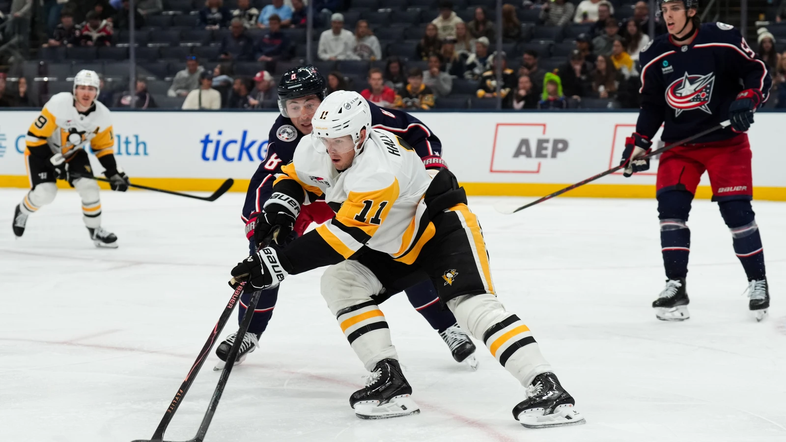 File photo: Pittsburgh Penguins centre Filip Hallander skates with the puck against Columbus Blue Jackets defenceman Zach Werenski during a preseason game on Sept. 24, 2026.