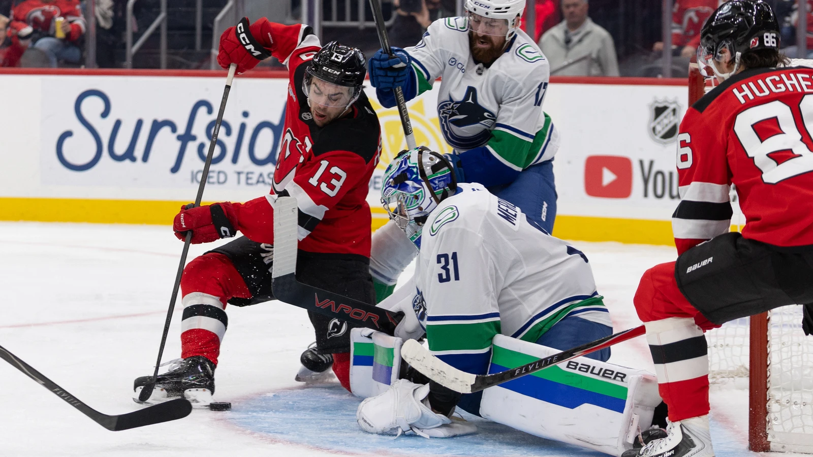 New Jersey Devils centre Nico Hischier shoots at the Vancouver Canucks net.
