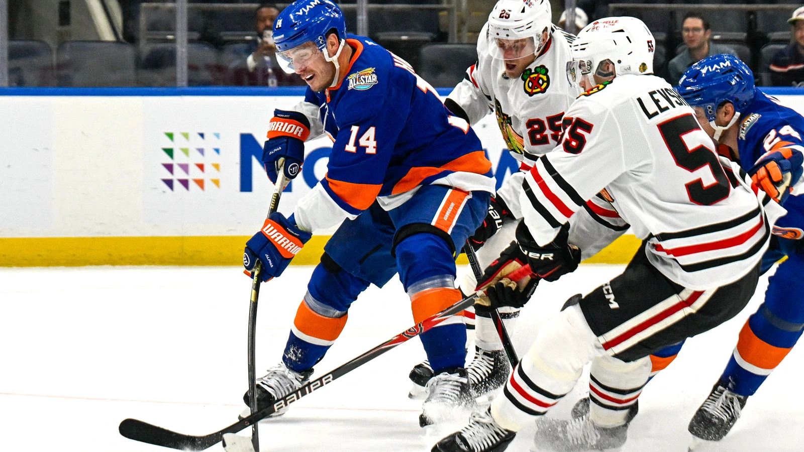 Bo Horvat attempts a shot for the New York Islanders against the Chicago Blackhawks at UBS Arena.