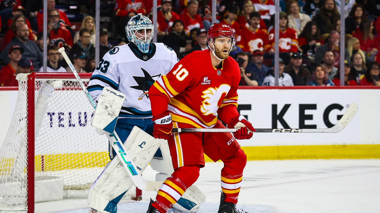 Jonathan Huberdeau screens San Jose goaltender Alex Nedeljkovic for Calgary on January 31, 2026. File photo.