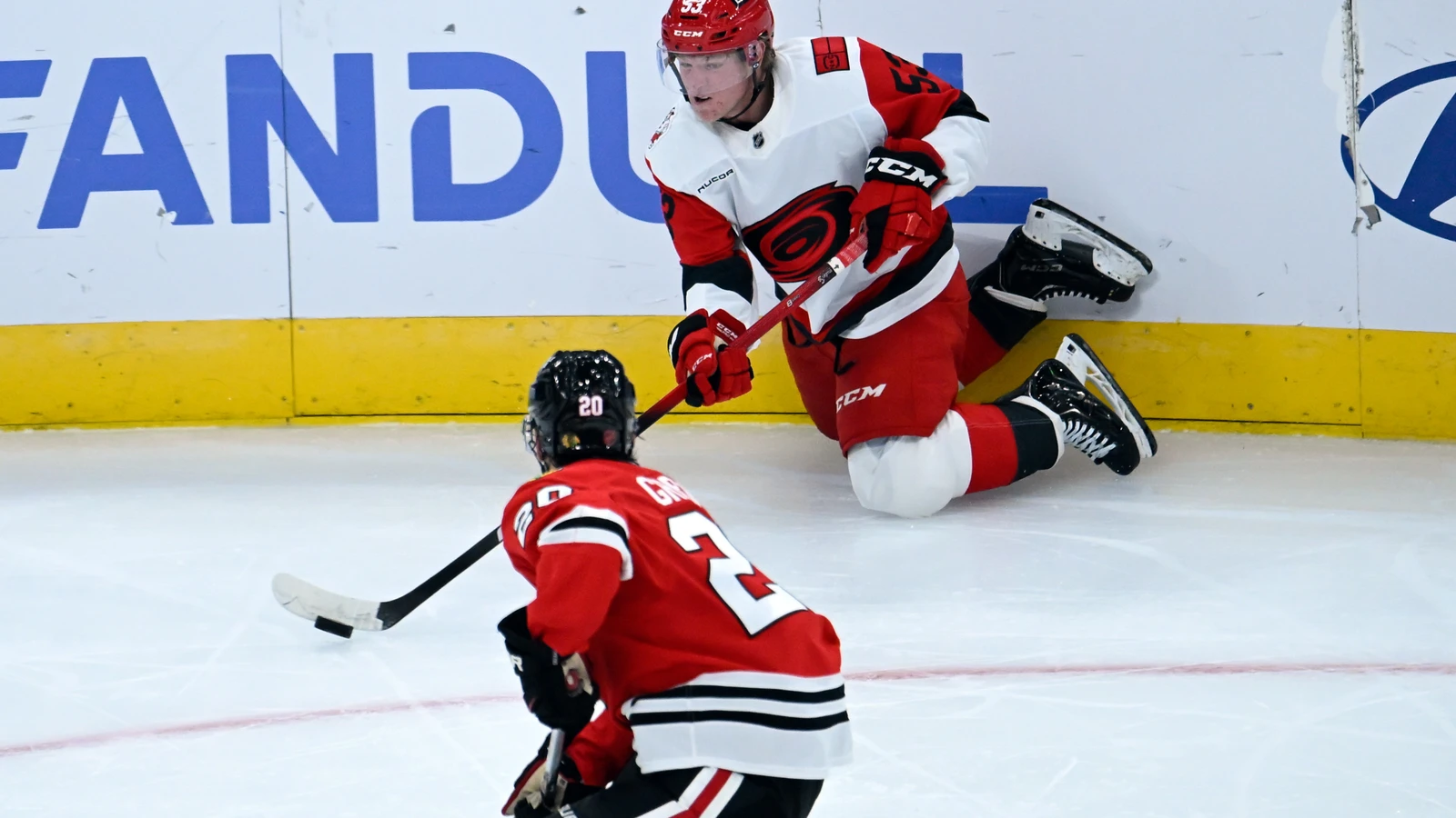 Carolina Hurricanes winger Jackson Blake moves the puck against the Chicago Blackhawks at United Center.