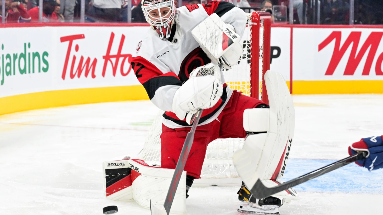 File photo: Carolina Hurricanes goaltender Brandon Bussi plays the puck against the Montreal Canadiens at the Bell Centre.