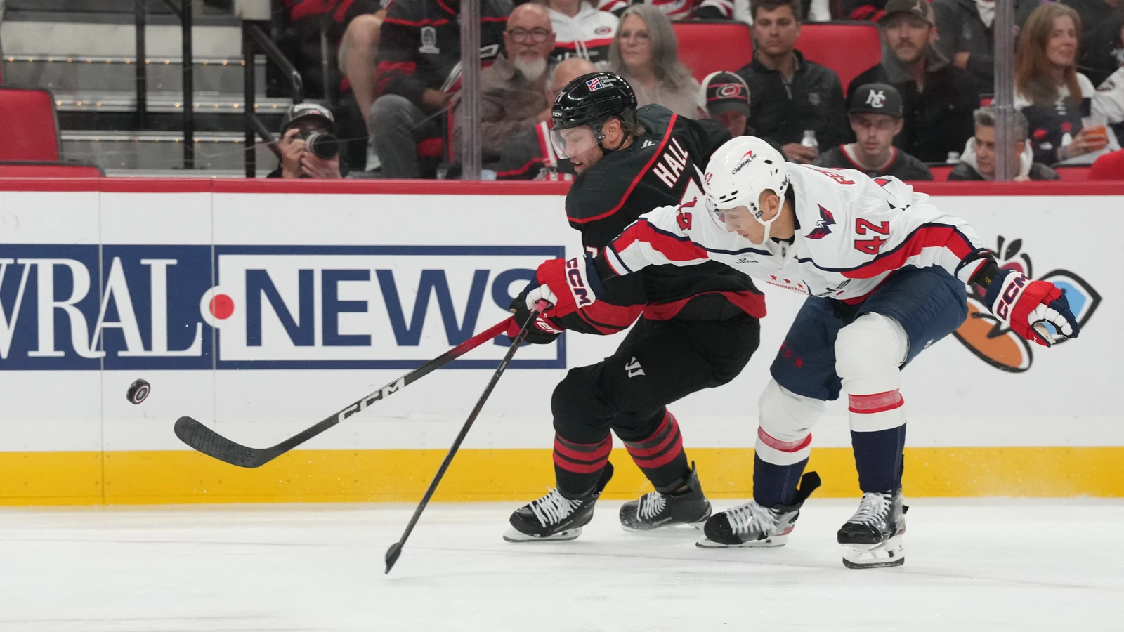 Carolina Hurricanes forward Taylor Hall pursues the puck beside Washington Capitals defenceman Martin Fehervary.
