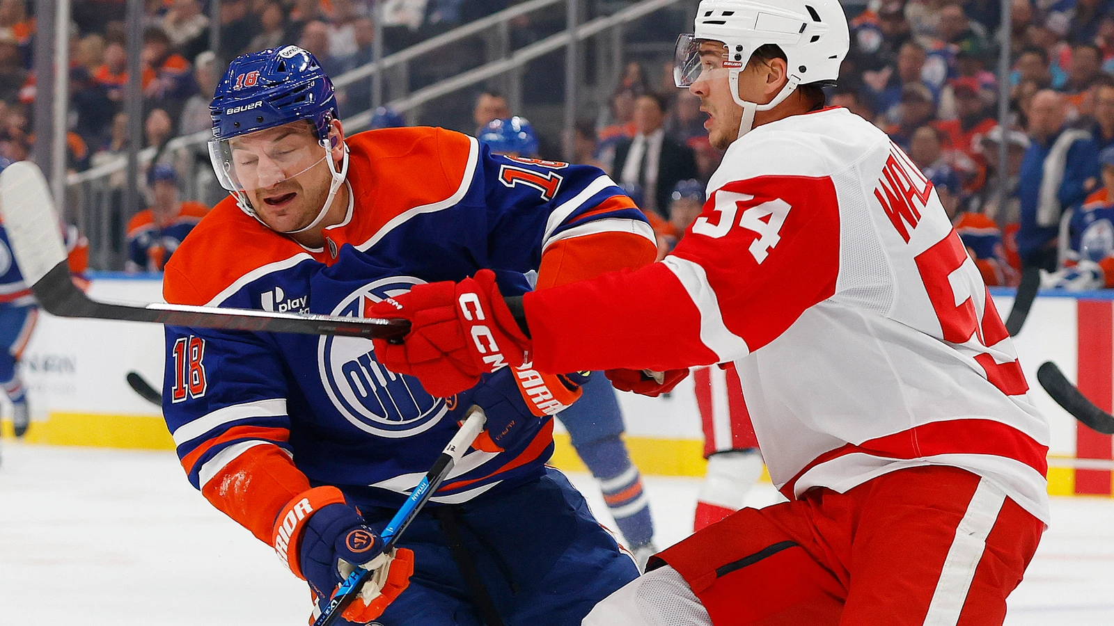 Edmonton Oilers forward Zach Hyman battles for position against a Detroit Red Wings defenceman at Rogers Place.