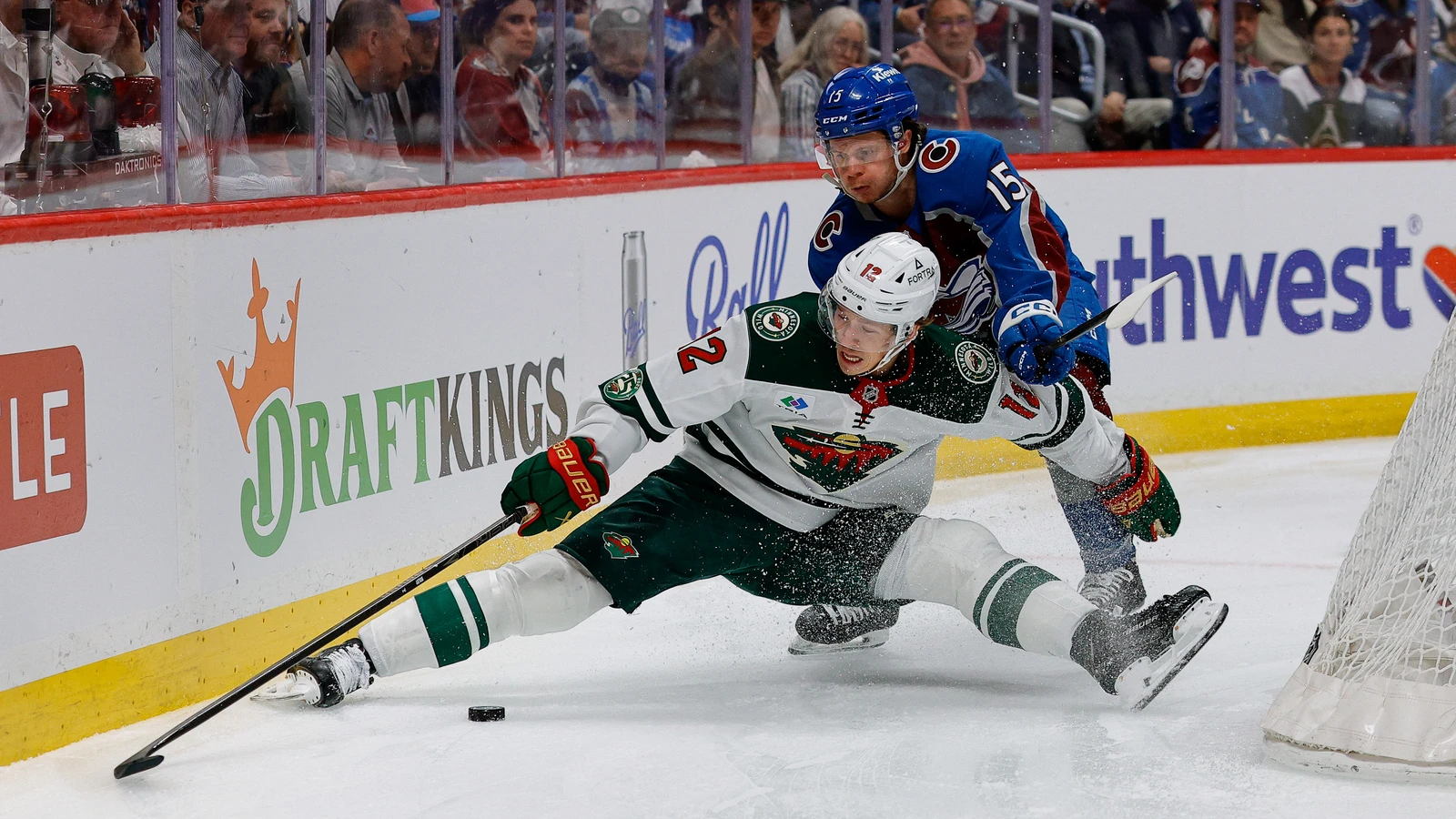Minnesota Wild winger Matt Boldy battles Colorado Avalanche defenseman Jack Ahcan for the puck during a playoff game on May 13, 2026. File photo.
