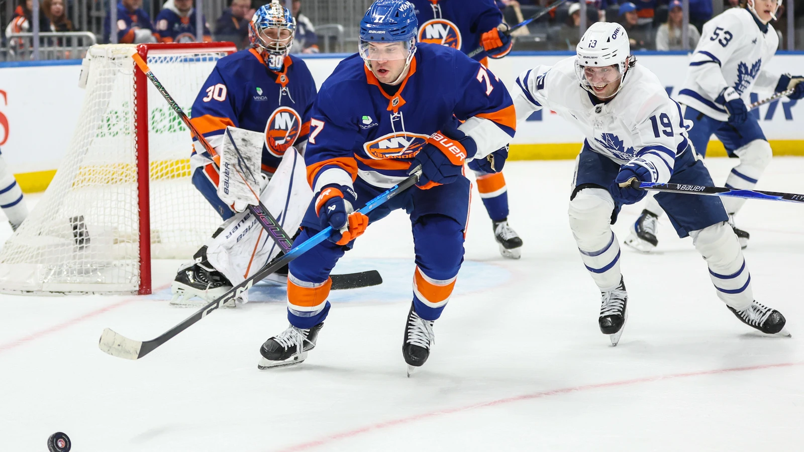 Islanders defenseman Tony DeAngelo battles Toronto's Calle Jarnkrok at UBS Arena in April 2026. File photo.