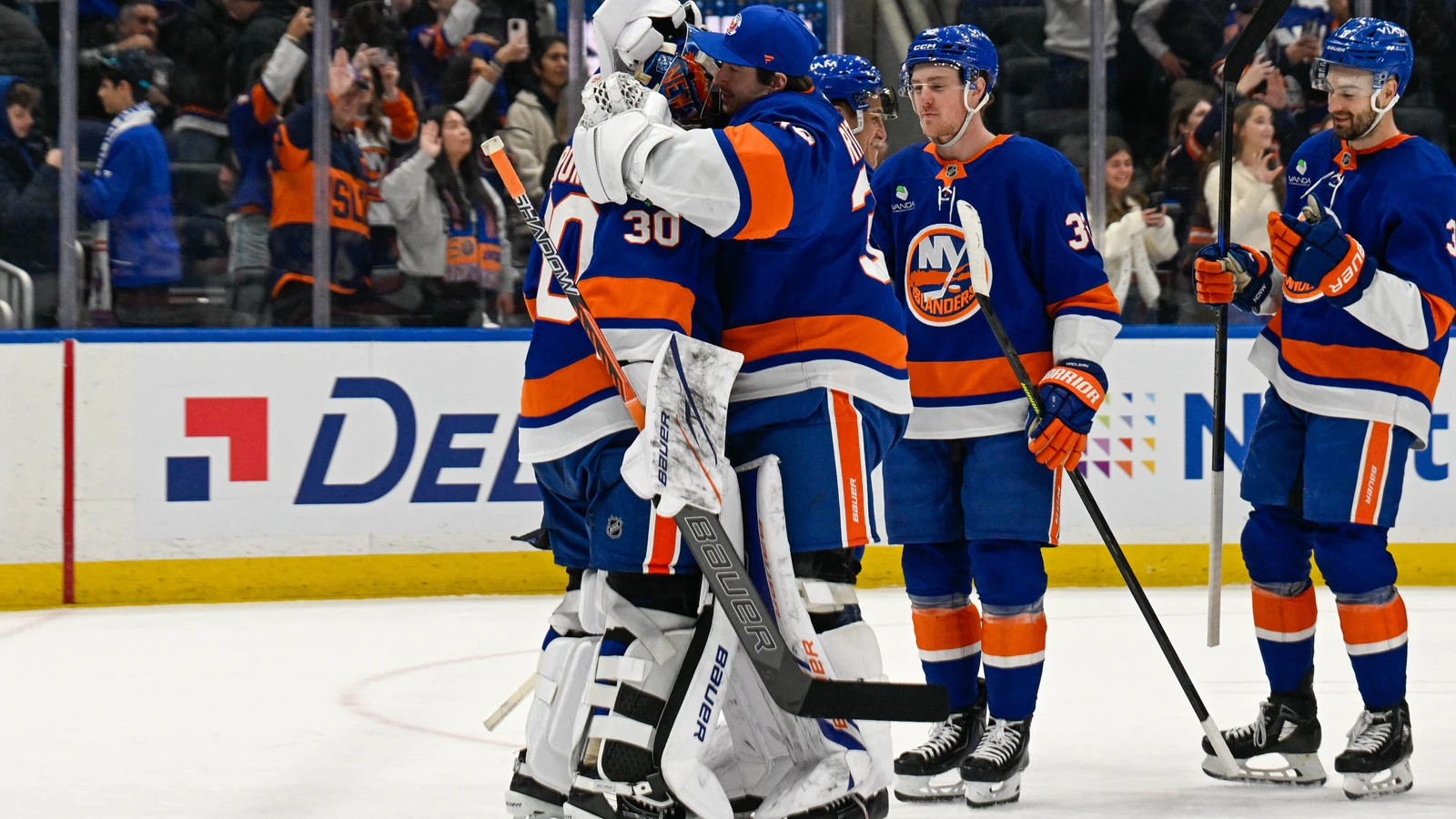 New York Islanders players wearing their current blue uniforms celebrate Ilya Sorokin's shutout against New Jersey at UBS Arena on January 6, 2026. File photo.
