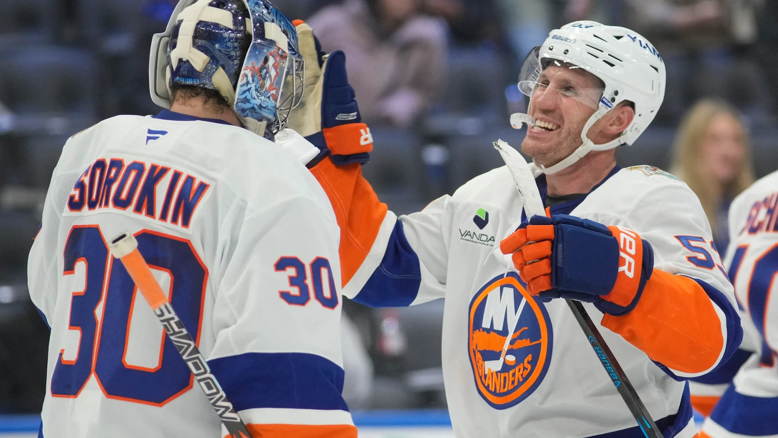 File photo: Casey Cizikas celebrates an Islanders victory with a teammate at Scotiabank Arena.