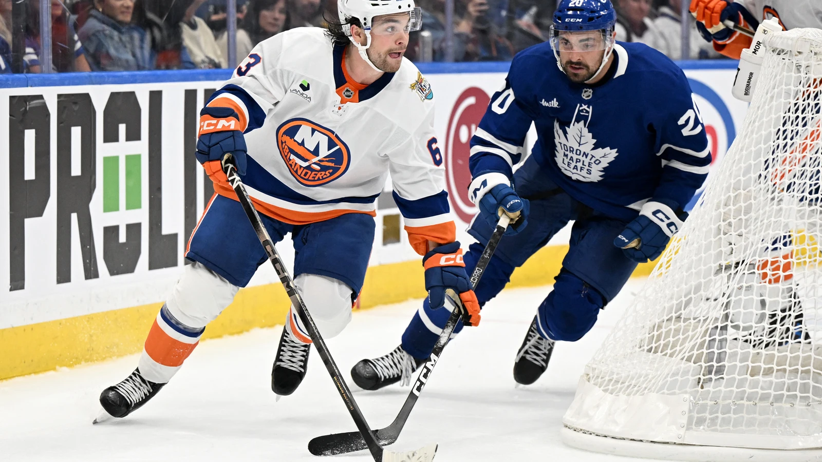 File photo: New York Islanders forward Matias Maccelli skates with the puck past Toronto Maple Leafs forward Nick Paul.