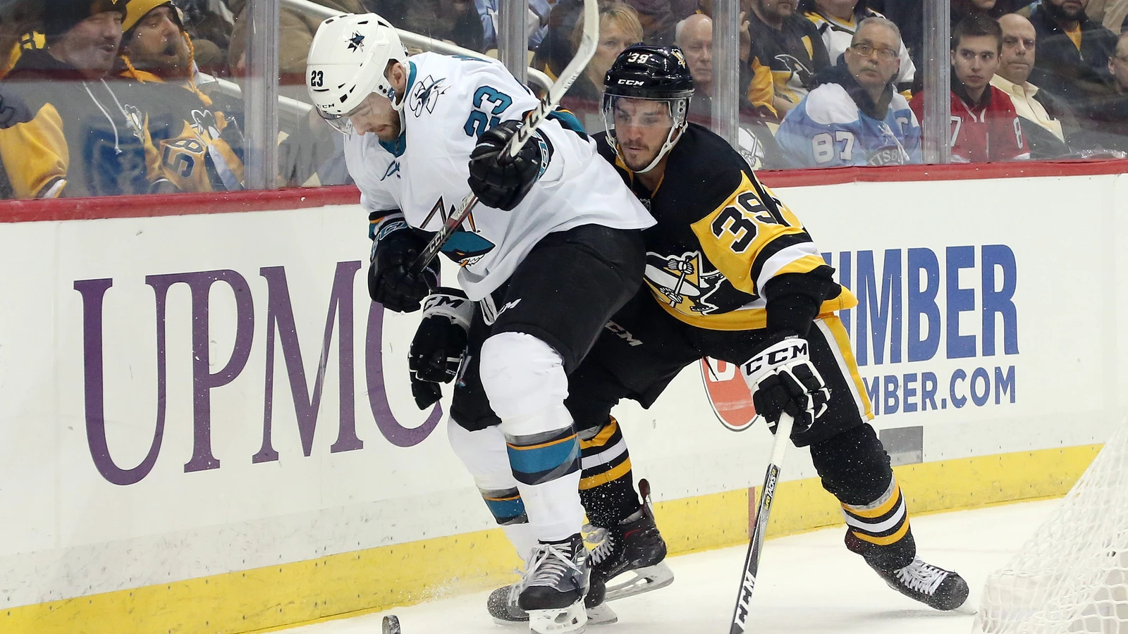 Jean-Sebastien Dea, No. 39 for Pittsburgh, battles San Jose’s Barclay Goodrow for the puck on January 30, 2018. File photo.