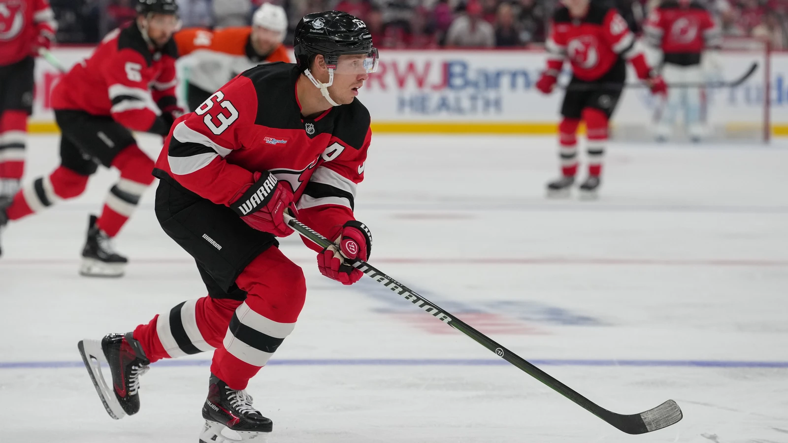 File photo: New Jersey Devils forward Jesper Bratt skates with the puck against the Philadelphia Flyers.