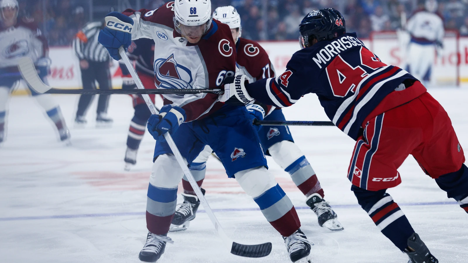 Winnipeg Jets defenceman Josh Morrissey defends against Colorado Avalanche forward Zachary L'Heureux at Canada Life Centre.
