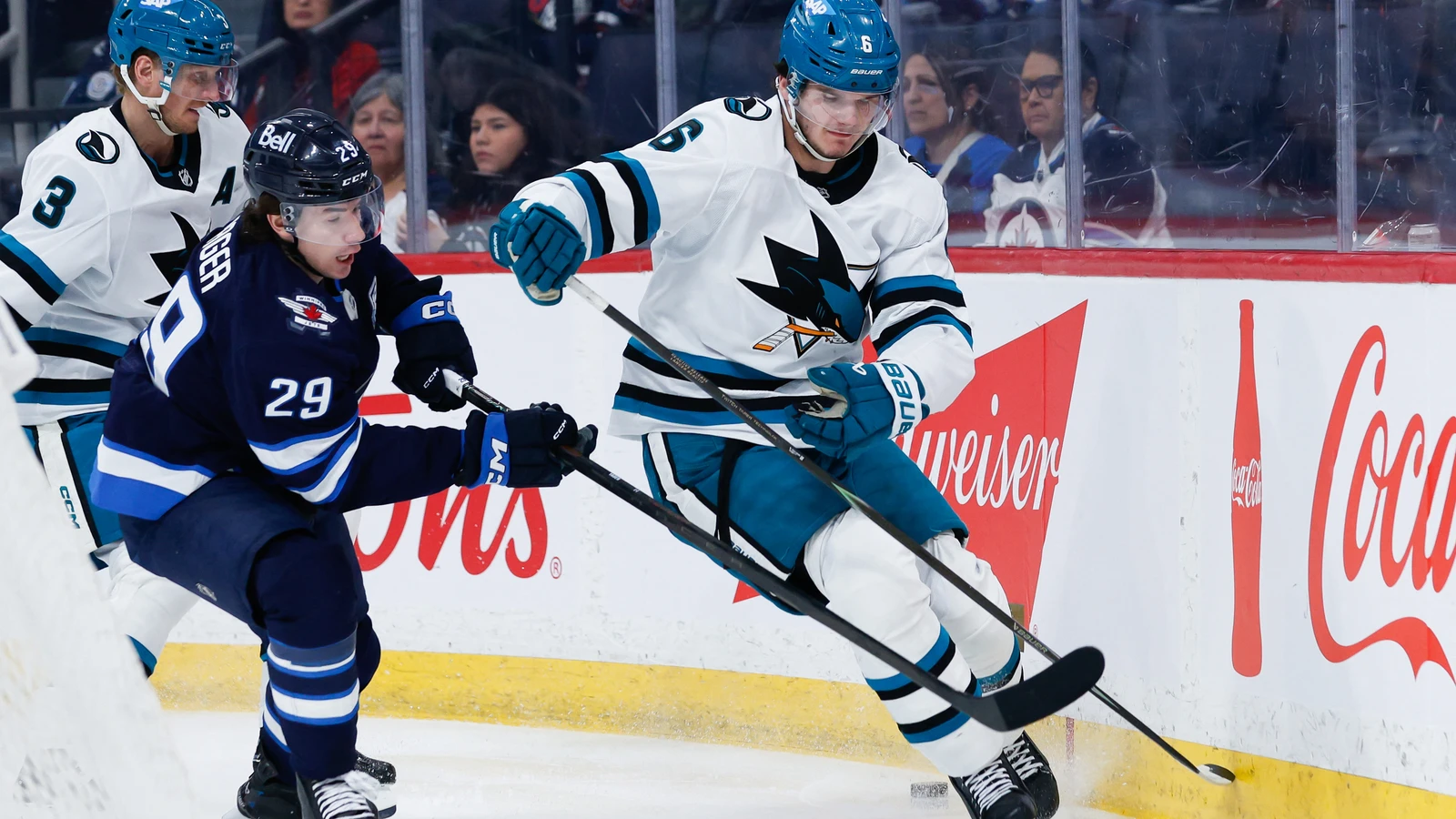 File photo: Winnipeg Jets forward Brayden Yager, No. 29, skates beside San Jose Sharks defenceman Sam Dickinson during a game in Winnipeg on April 16, 2026.