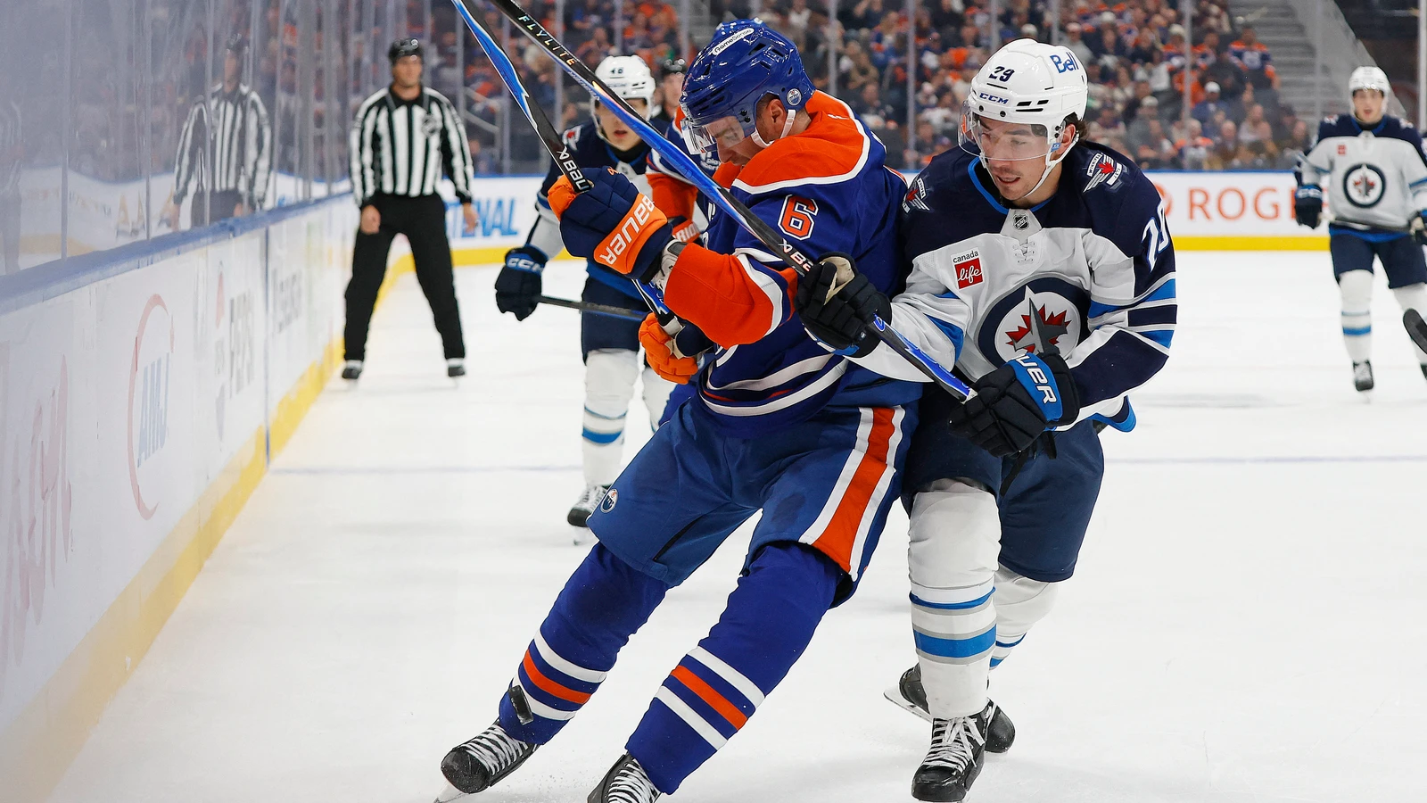 File photo: Winnipeg Jets forward Brayden Yager battles Edmonton Oilers defenceman Ryan Shea for the puck along the boards.