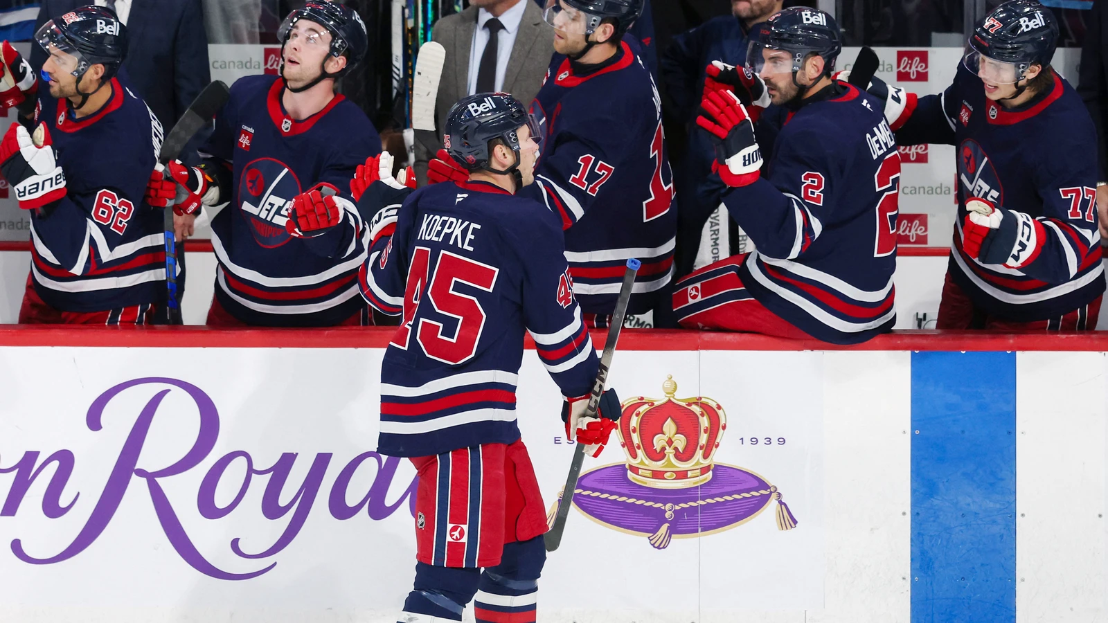 File photo: Jets left wing Cole Koepke celebrates a goal against the Wild with teammates at Canada Life Centre.