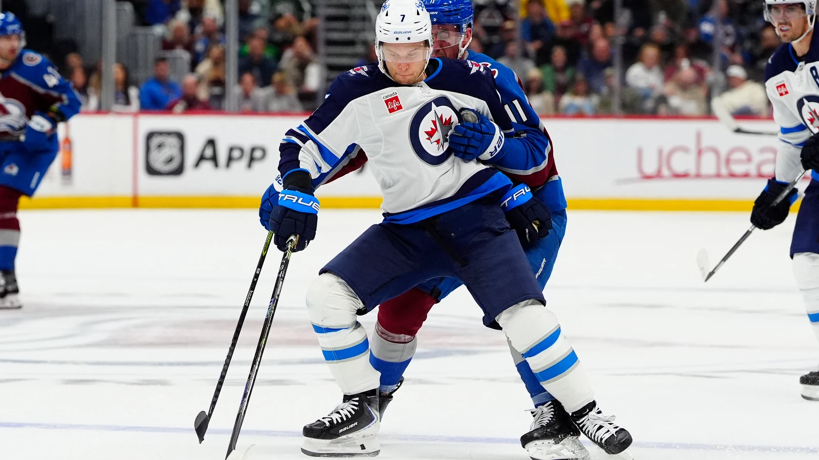 File photo: Winnipeg Jets centre Vladislav Namestnikov shields the puck from a Colorado Avalanche player.
