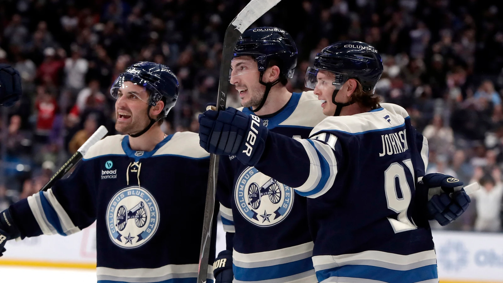 Columbus Blue Jackets forward Kent Johnson celebrates his overtime goal with teammates against the New York Rangers at Nationwide Arena.