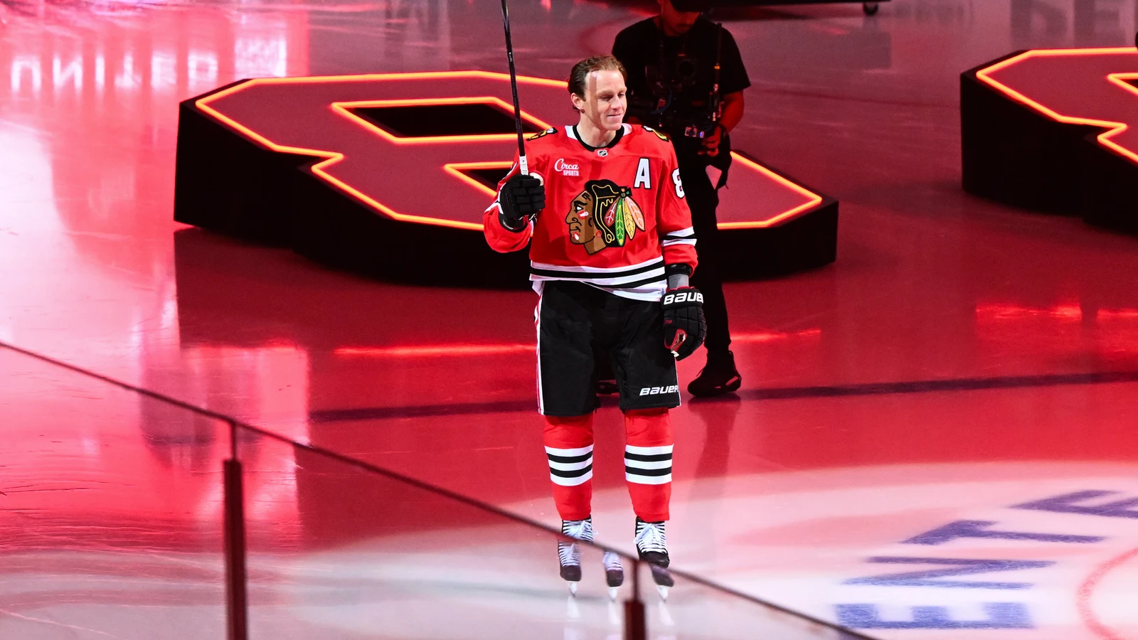 Chicago Blackhawks forward Patrick Kane raises his stick as he is introduced before the home opener against the St. Louis Blues at United Center on Oct. 6, 2026.