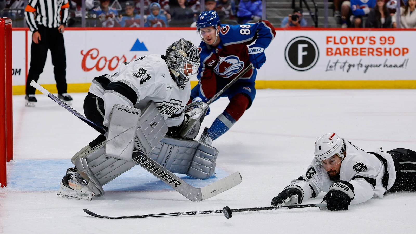 Drew Doughty dives for the puck during an April 2026 playoff game against Colorado. File photo.