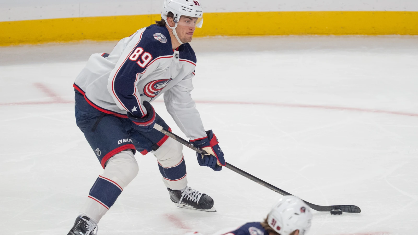 File photo: Columbus Blue Jackets forward Matthew Knies skates with the puck against the Minnesota Wild at Grand Casino Arena.