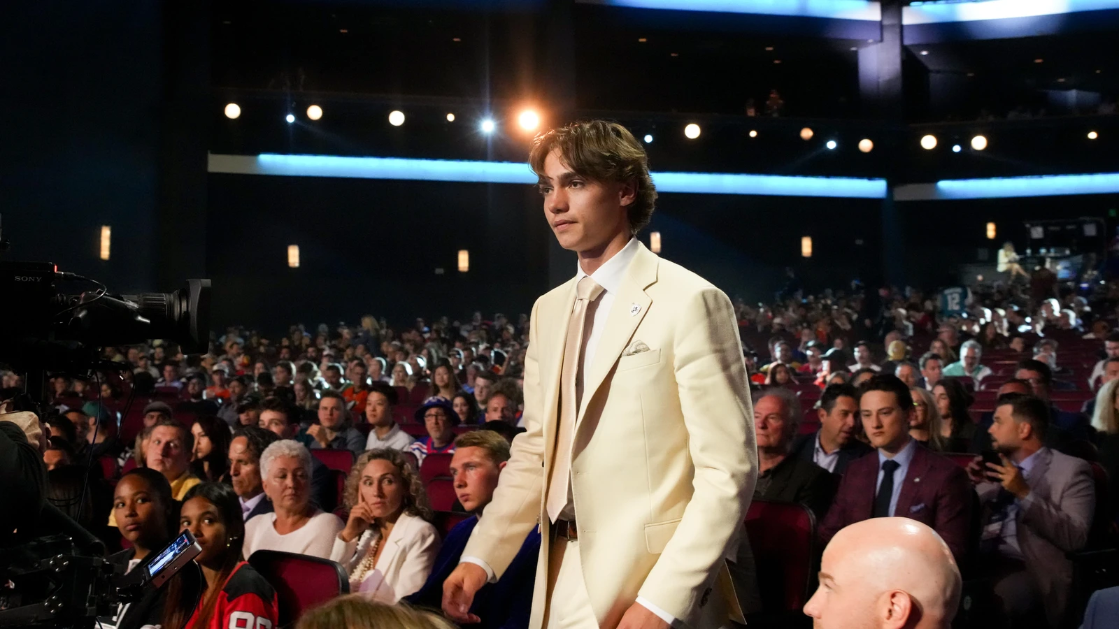 Jake O'Brien walks through the NHL Draft venue after the Seattle Kraken selected him eighth overall on June 27, 2025. File photo.