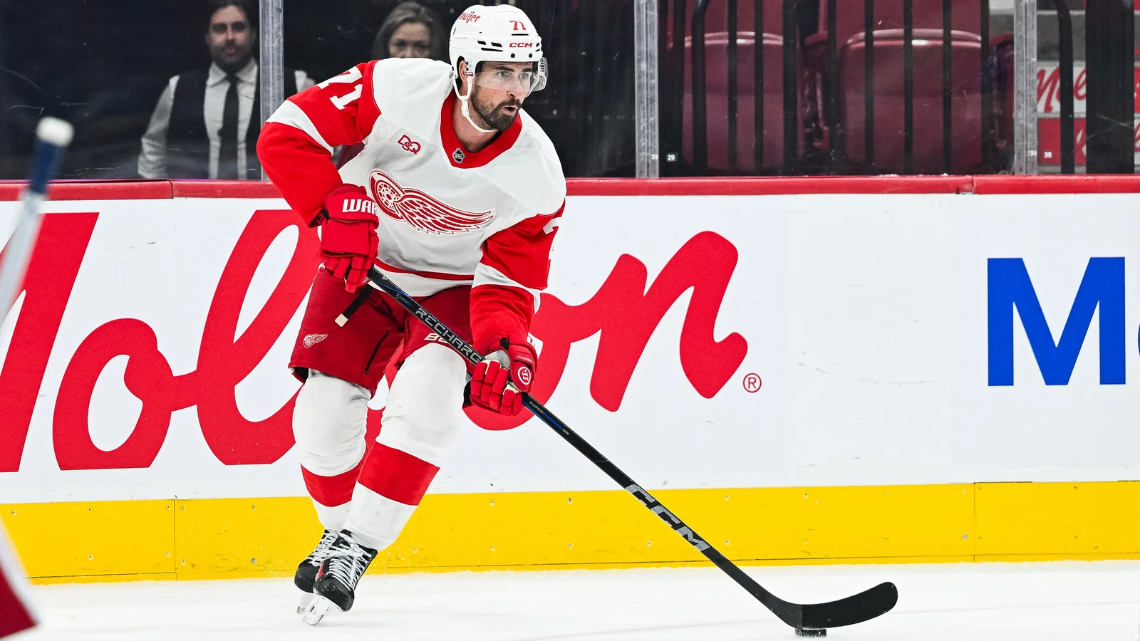 Dylan Larkin controls the puck along the boards at Bell Centre against the Montreal Canadiens.