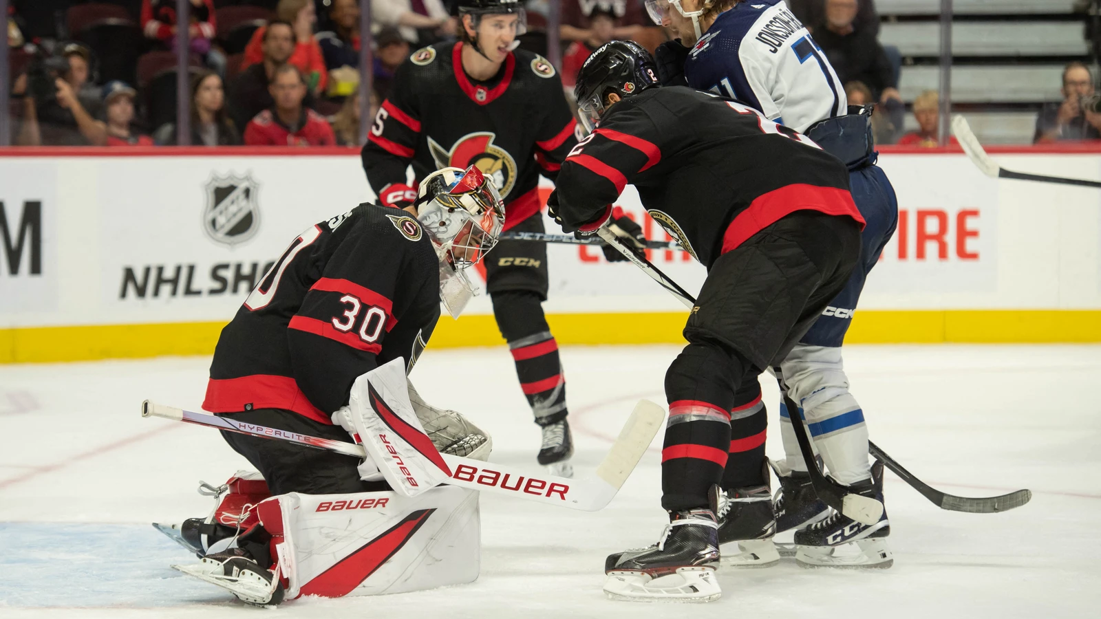 Ottawa Senators goaltender Kevin Mandolese, number 30, makes a save against Winnipeg during a September 29, 2023 preseason game. File photo; Mandolese is one of Laval’s four signees, and the image does not show the other three or a Laval uniform.