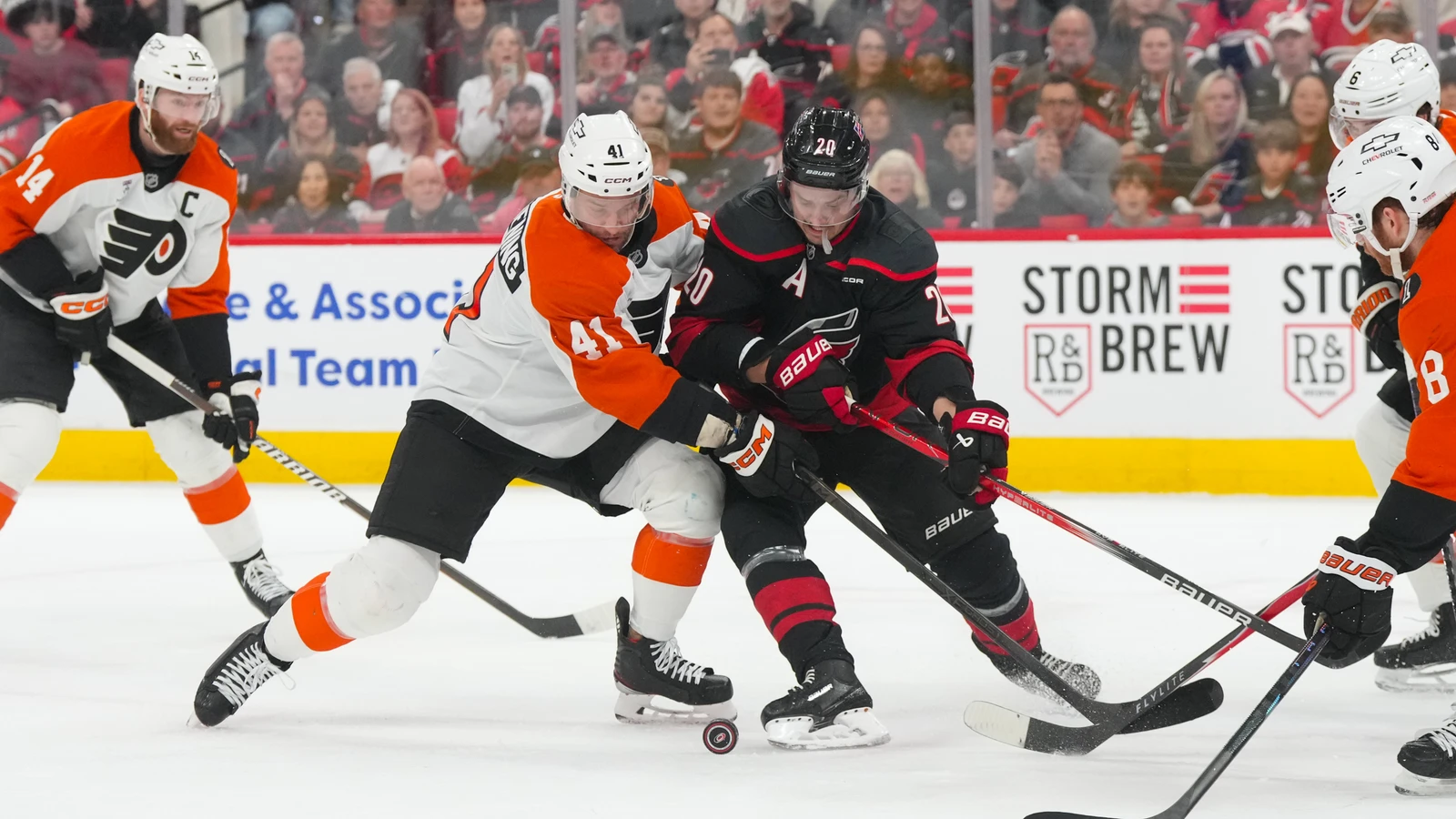 File photo: Luke Glendening, wearing a Philadelphia Flyers jersey, battles Carolina Hurricanes centre Sebastian Aho for the puck in Raleigh on May 2, 2026.