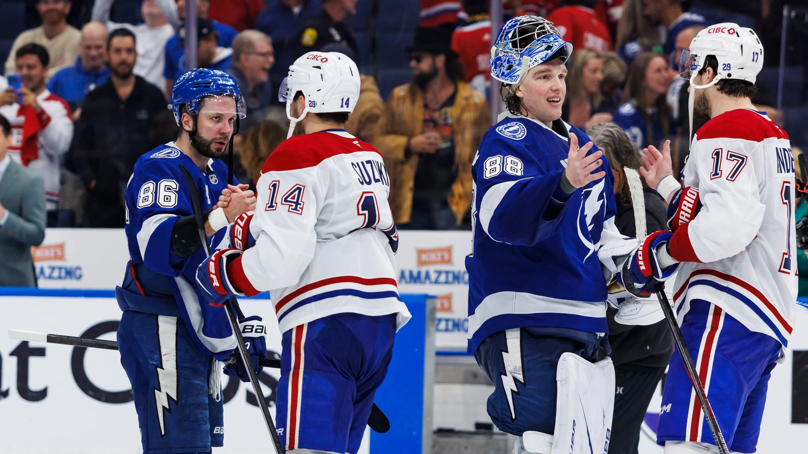 Nikita Kucherov and Andrei Vasilevskiy greet Montreal players after a May 2026 playoff game. File photo.