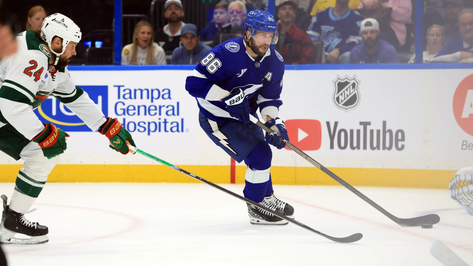 File photo: Nikita Kucherov carries the puck for the Tampa Bay Lightning as a Minnesota Wild defender pursues him.