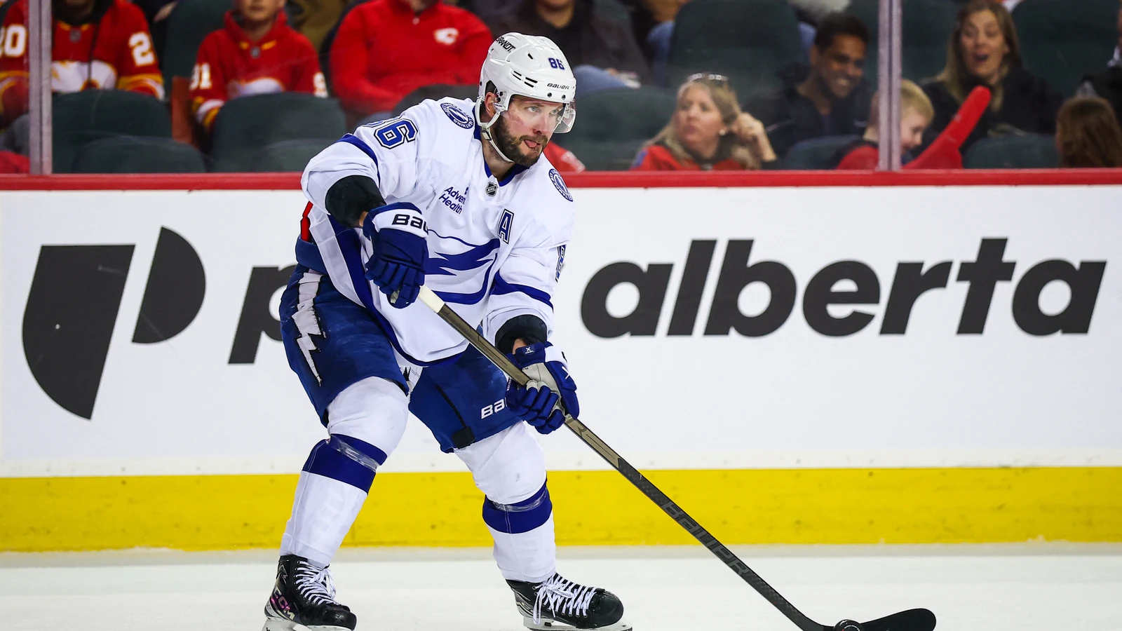 File photo: Tampa Bay Lightning forward Nikita Kucherov skates with the puck against Calgary at Scotiabank Saddledome on March 22, 2026.