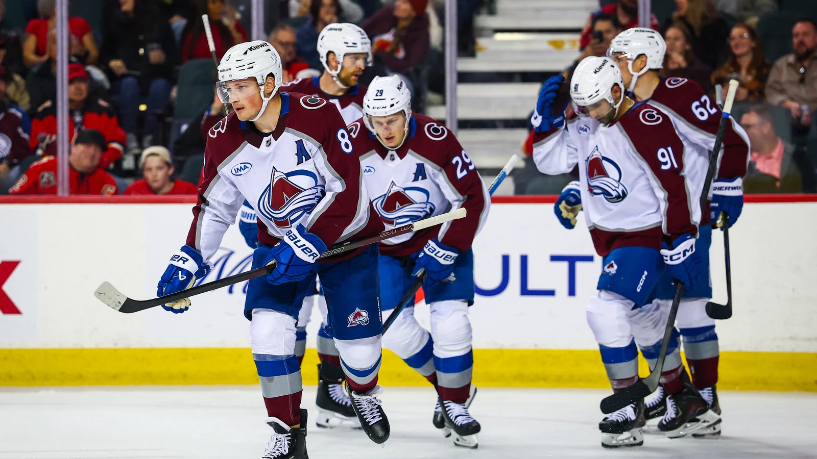 Avalanche defenceman Cale Makar skates with teammates after scoring against the Flames at Scotiabank Saddledome in Calgary.