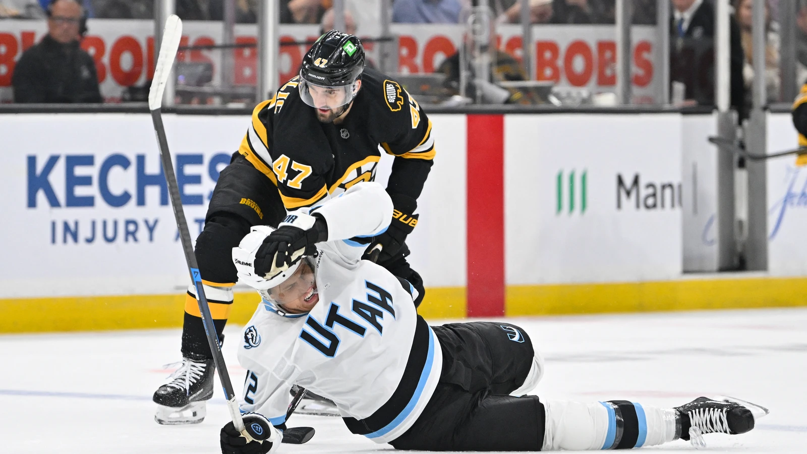 File photo: Utah Mammoth forward Anders Lee lies on the ice after a check during a game against the Boston Bruins.