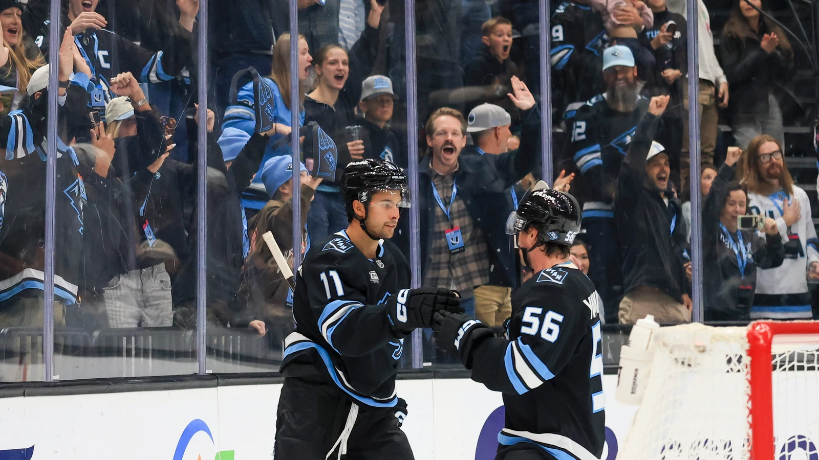 Dylan Guenther celebrates his goal with a Utah Mammoth teammate against the Toronto Maple Leafs at Delta Center.