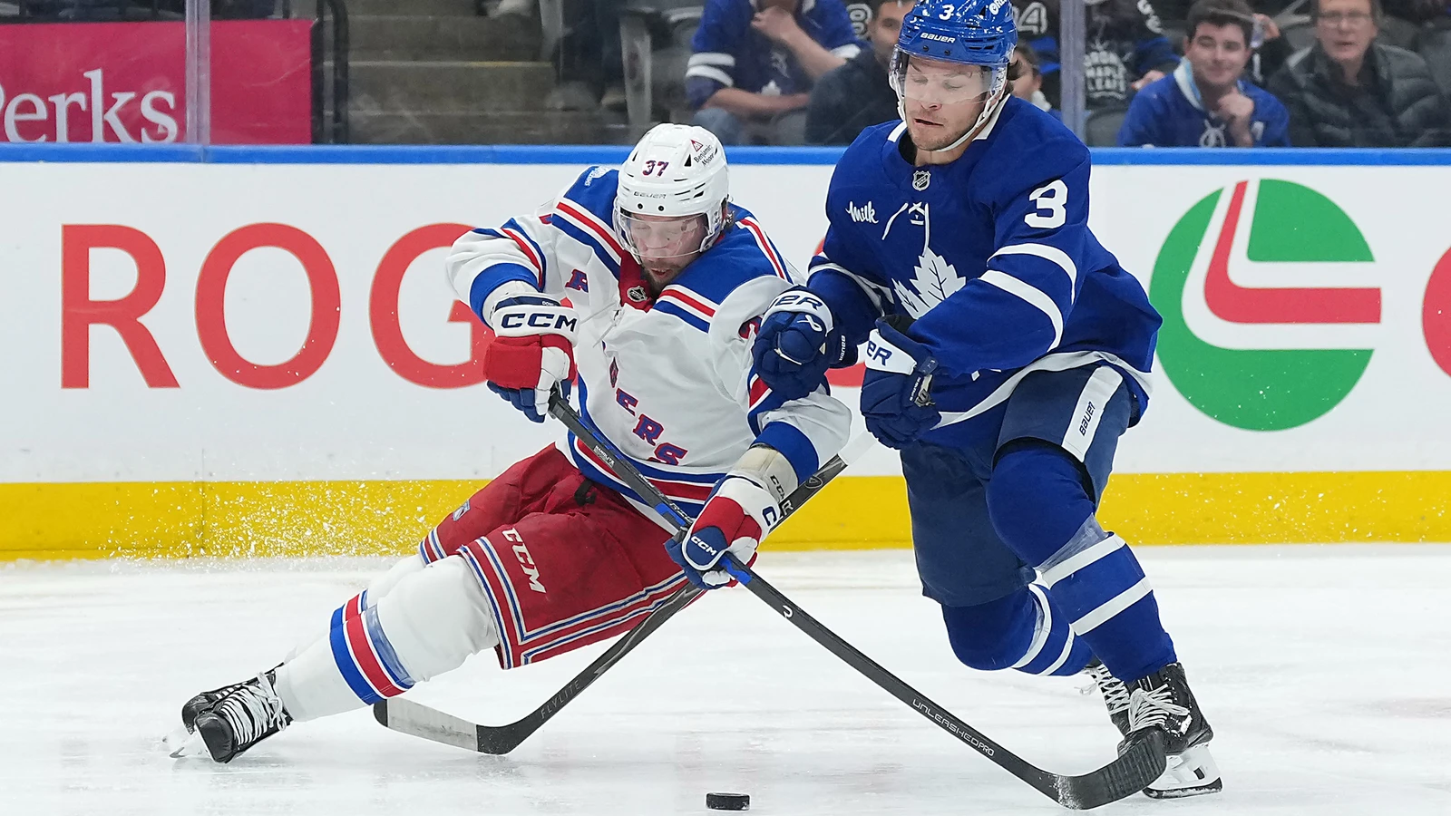 File photo: Toronto Maple Leafs defenceman Nick Blankenburg battles for the puck with New York Rangers centre Justin Dowling at Scotiabank Arena.