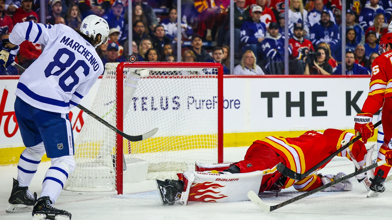 File photo: Toronto Maple Leafs winger Kirill Marchenko shoots against the Calgary Flames at Scotiabank Saddledome.