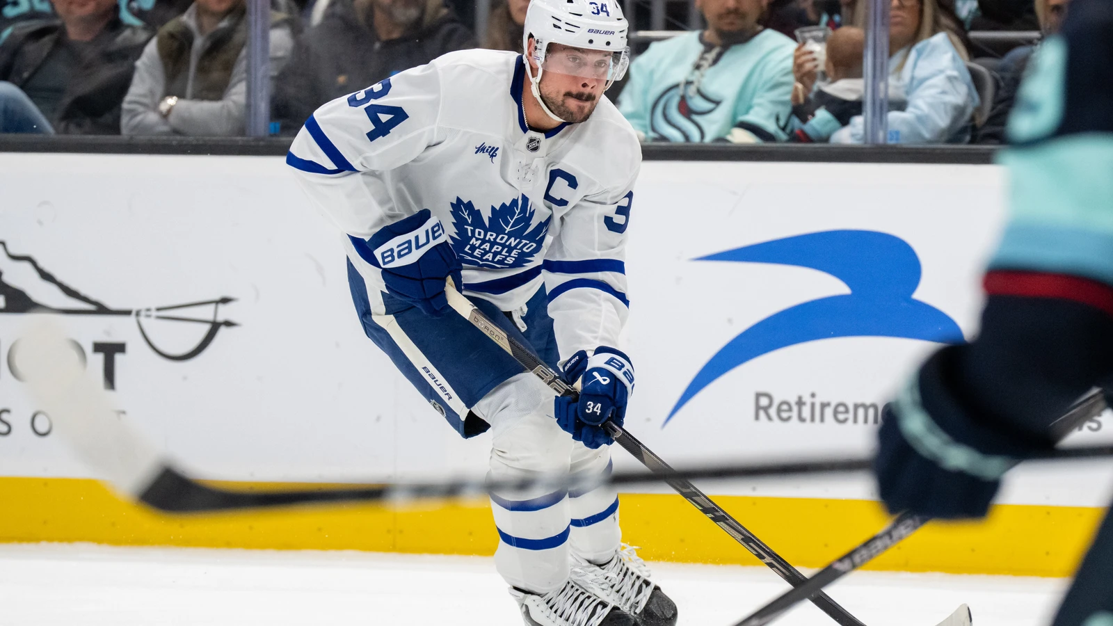 File photo: Toronto Maple Leafs forward Auston Matthews skates with the puck against the Seattle Kraken.