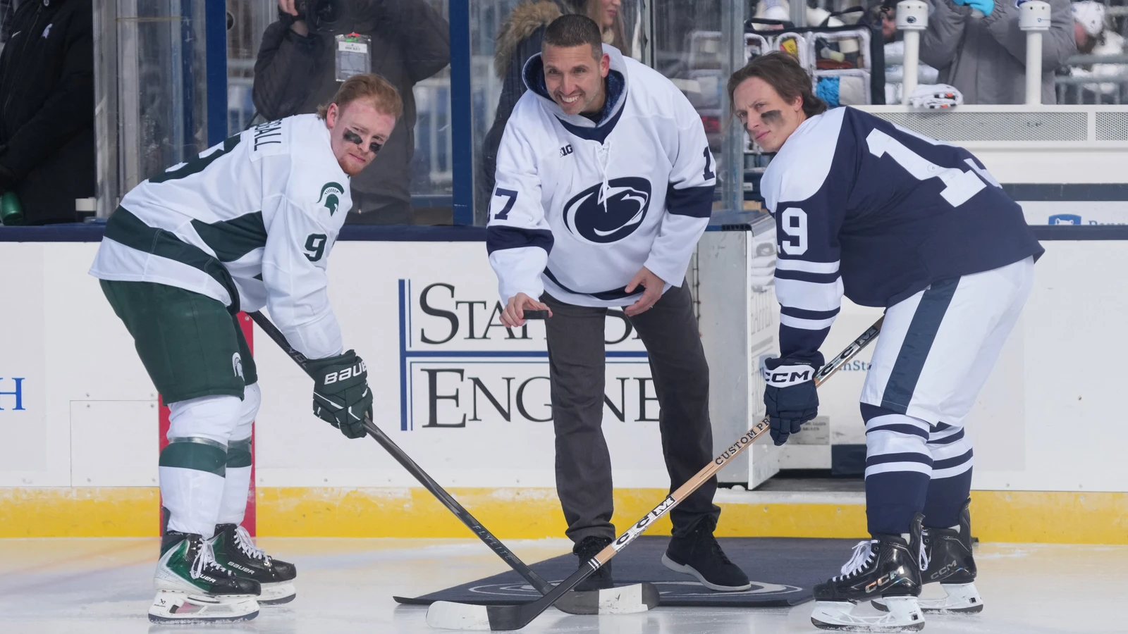 Matt Basgall, left, awaits a ceremonial puck drop for Michigan State against Penn State on January 31, 2026. File photo.