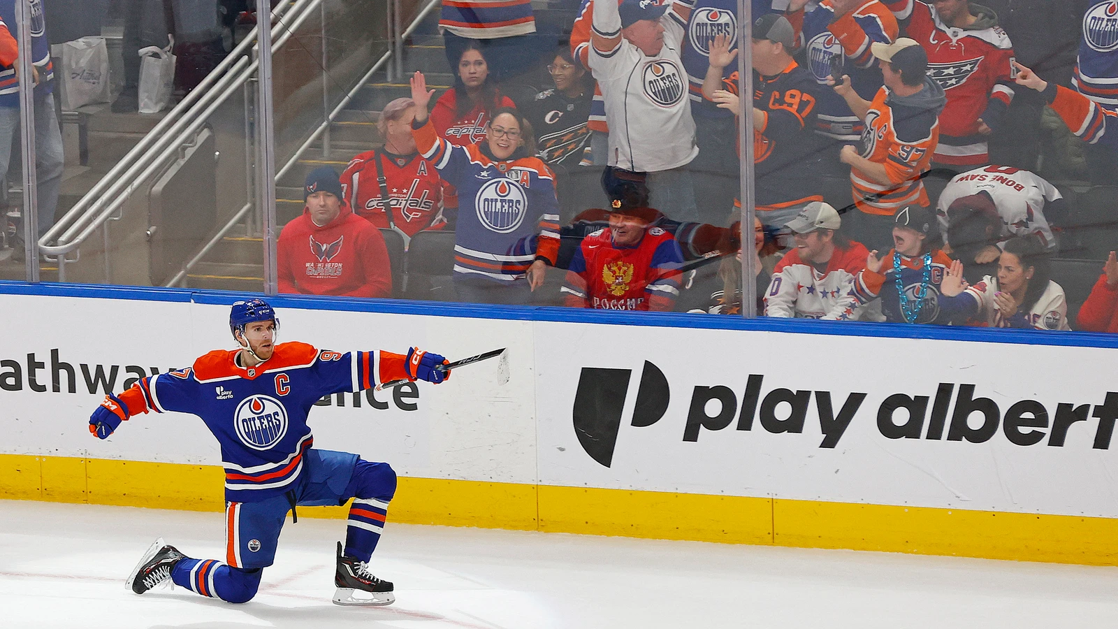 File photo: Connor McDavid celebrates a goal on one knee in front of cheering fans at Rogers Place.