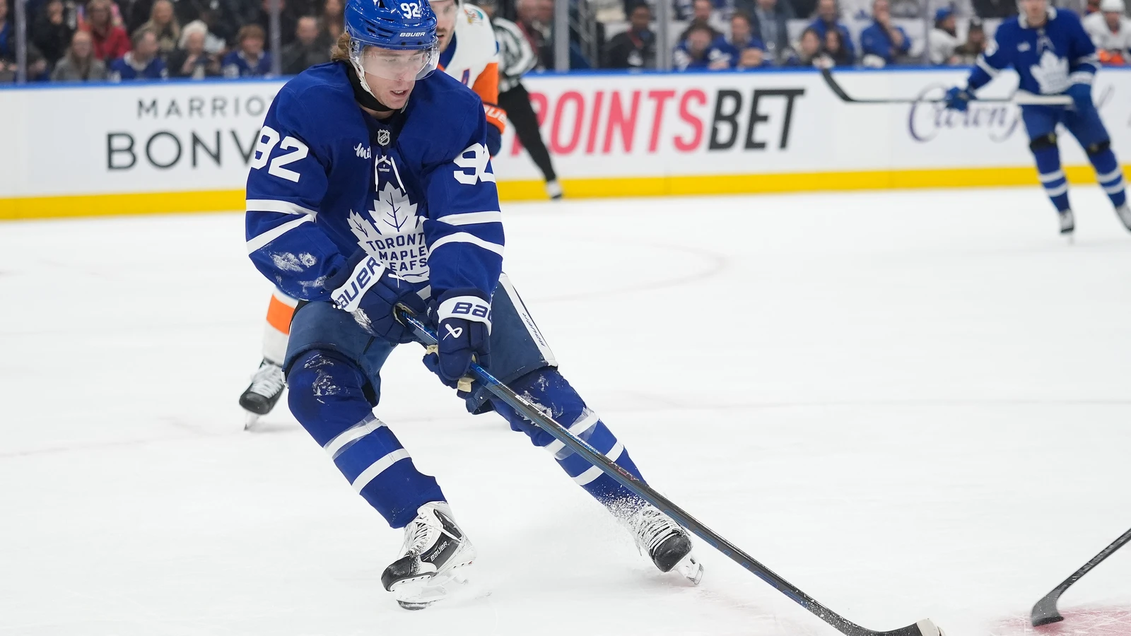 File photo: Toronto Maple Leafs forward Gavin McKenna controls the puck against the New York Islanders at Scotiabank Arena.