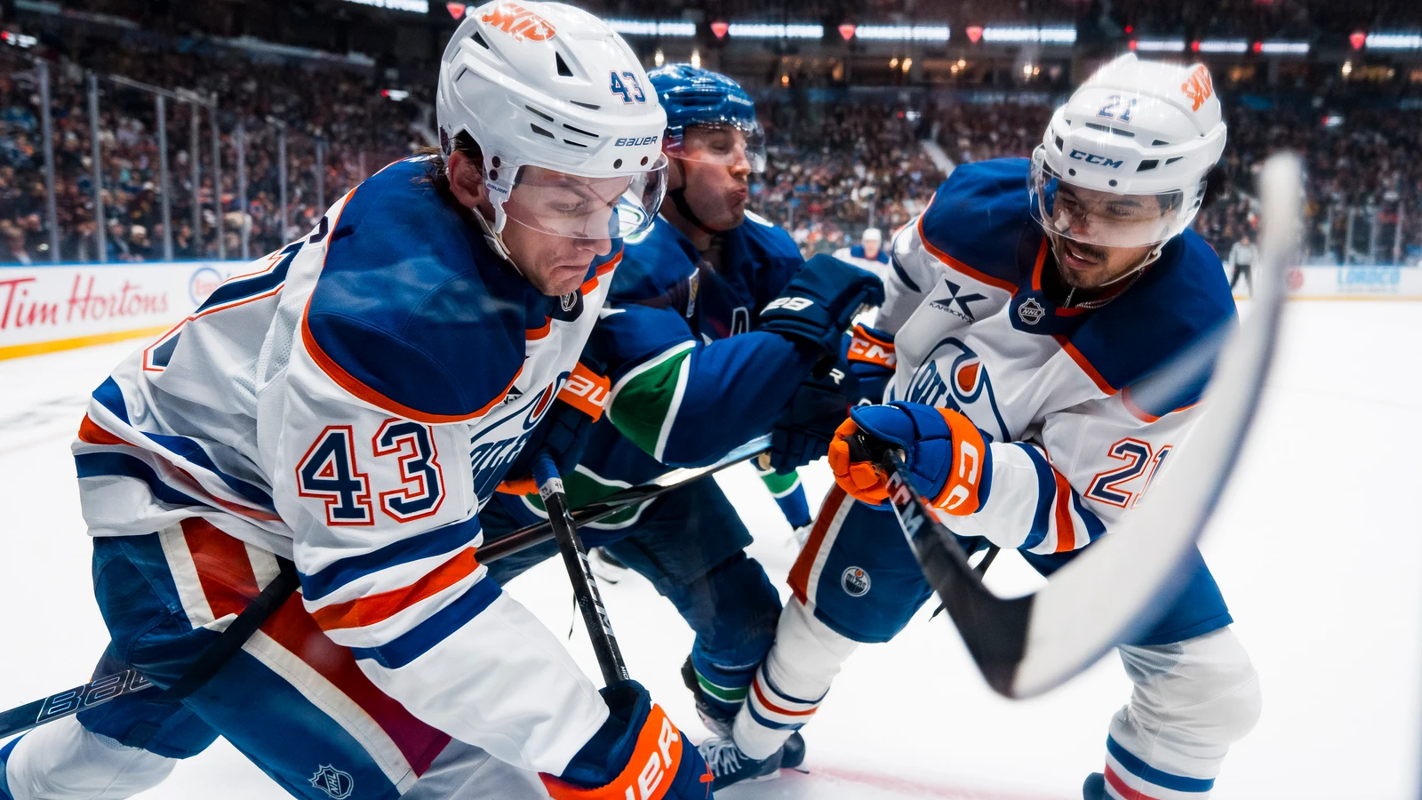 File photo: Edmonton Oilers forward Owen Michaels (43) battles along the boards against the Vancouver Canucks at Rogers Arena.