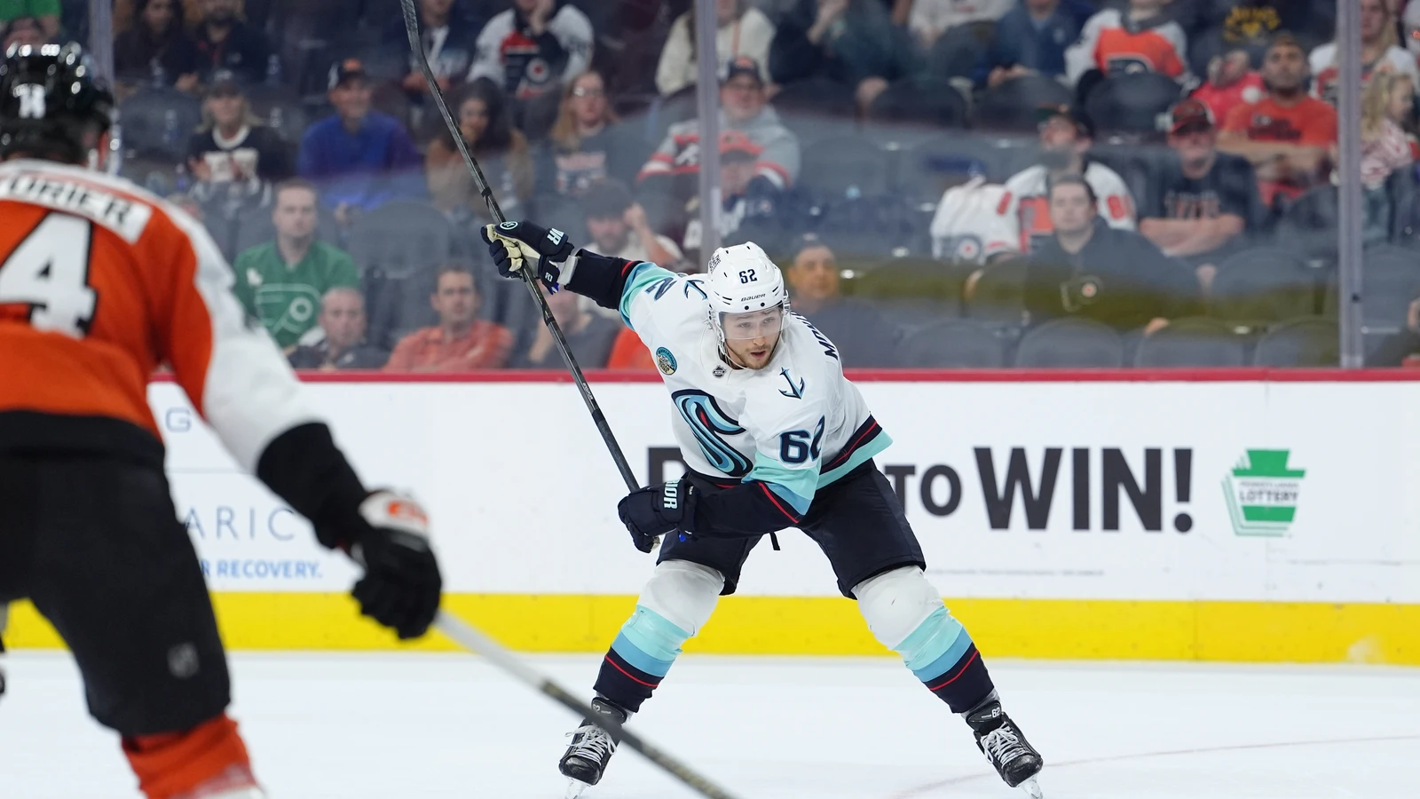 File photo: Kraken defenseman Brandon Montour shoots the puck against the Flyers at Xfinity Mobile Arena in Philadelphia.