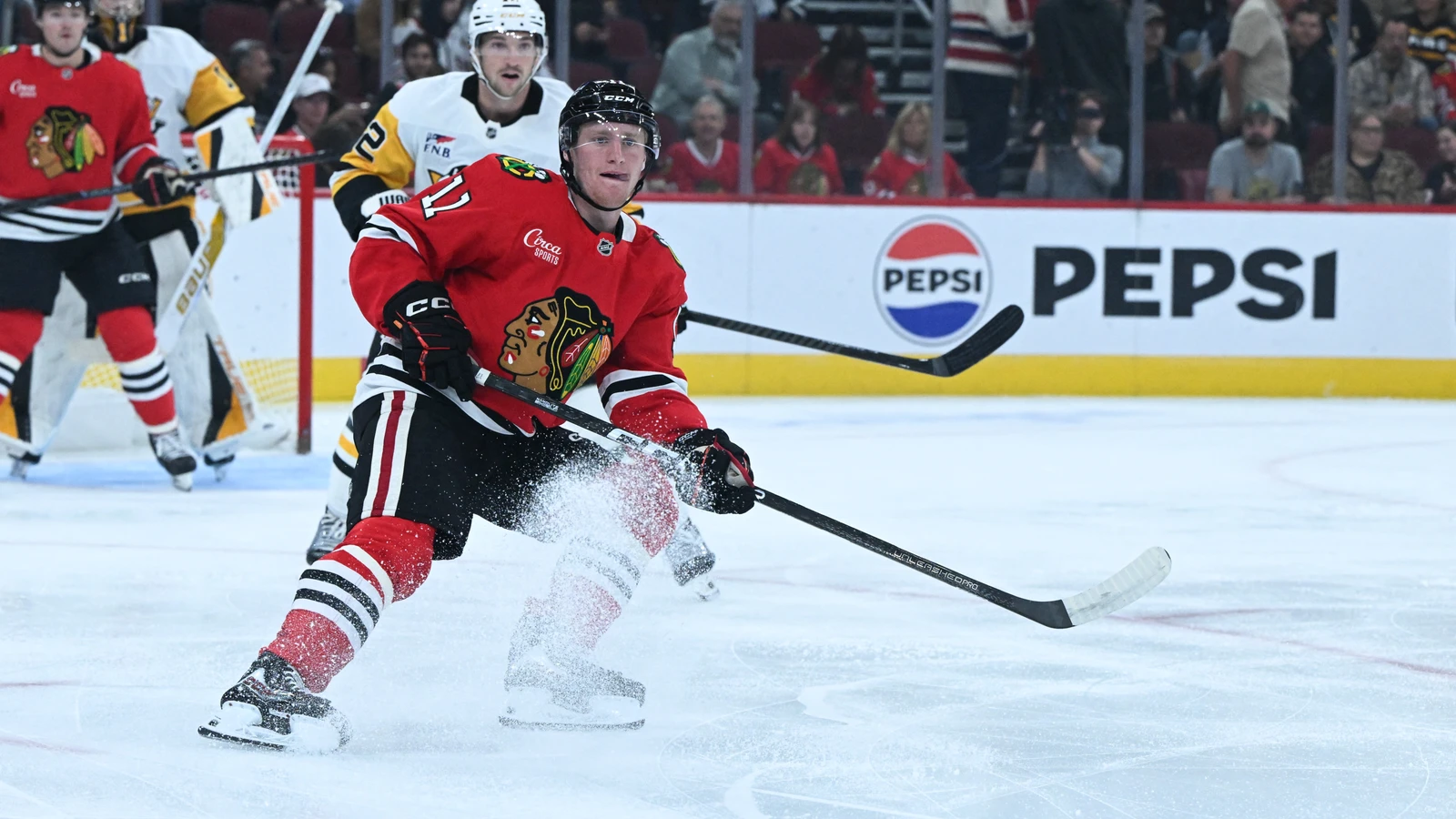 File photo: Chicago Blackhawks centre Oliver Moore kicks up ice while skating against the Pittsburgh Penguins at United Center.