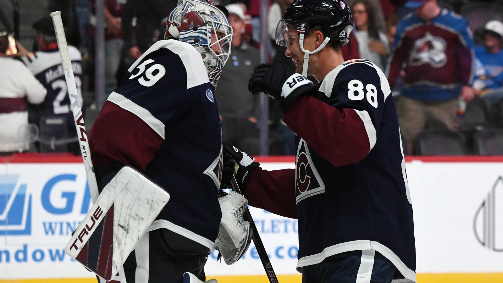 Martin Necas celebrates with Colorado Avalanche goaltender Mackenzie Blackwood after a win against the St. Louis Blues at Ball Arena.