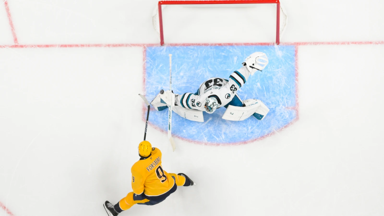 San Jose Sharks goaltender Alex Nedeljkovic makes a shootout save against the Nashville Predators at Bridgestone Arena.